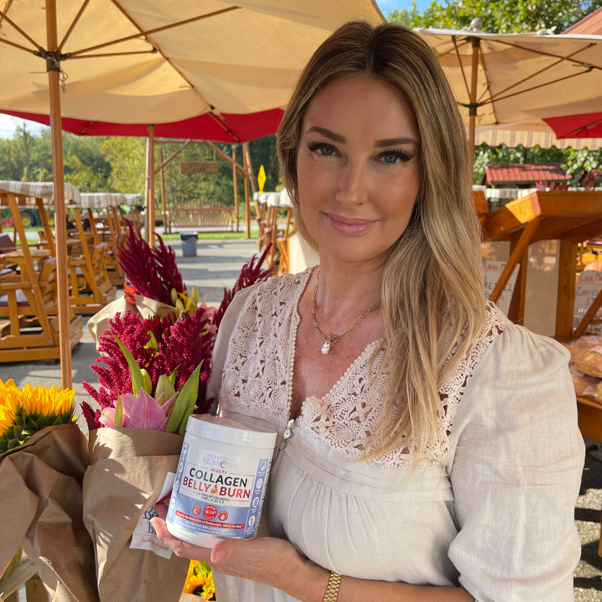 Beautiful Woman holding Collagen Belly Burn - Multi Collagen Powder