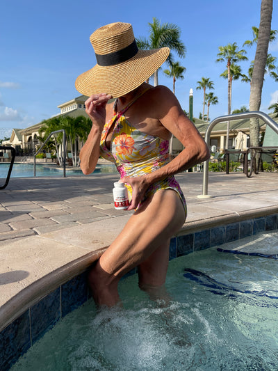 Customer holding Extreme Belly Burn Capsules